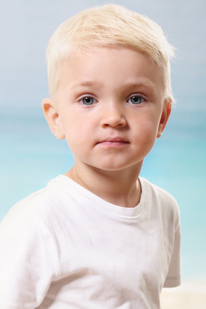 Beautiful little boy on the beachの写真素材