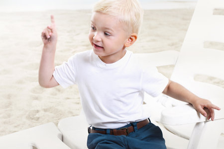 Beautiful little boy on the beachの写真素材