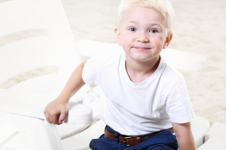 Beautiful little boy on the beachの写真素材