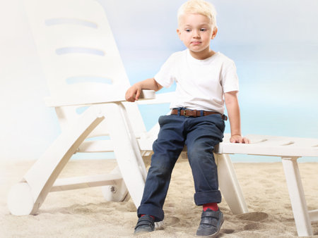 Beautiful little boy on the beachの写真素材