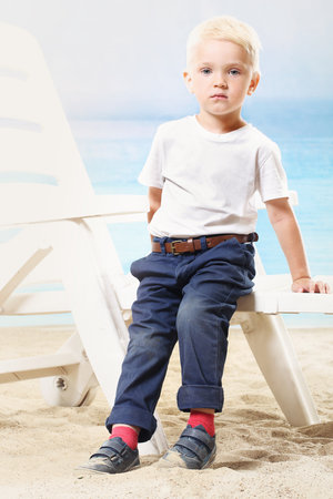 Beautiful little boy on the beachの写真素材