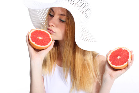 Girl with fresh grapefruitの写真素材