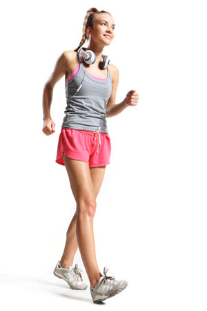 beautiful woman marching to the beat of musicの写真素材