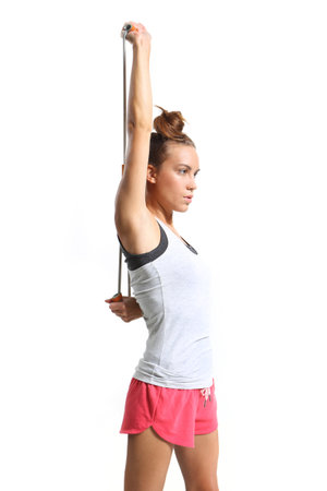 athletic woman stretching back muscles training with rubberの写真素材