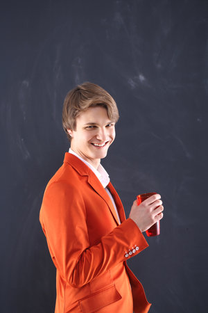Portrait of a boy with coffee beans on a black background の写真素材