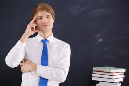 Male teacher thinkingの写真素材