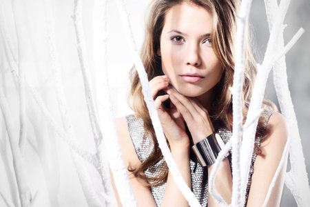 Form sensual woman in a silver dress in the fashion stage design の写真素材