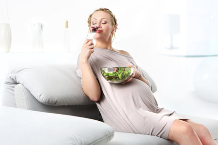 Pregnancy cravings Young mom takes care of a healthy diet for yourself and your unborn childの写真素材