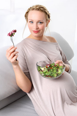 Nutrition in pregnancy Young mom takes care of a healthy diet for yourself and your unborn childの写真素材