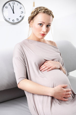 Fear of childbirth  Pregnant woman hugs pregnancy tummy   の写真素材