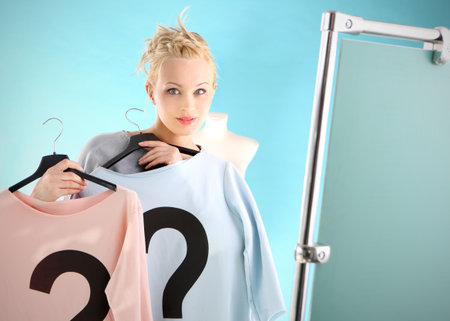 Shopping dilemmas - a woman in dressing room  の写真素材