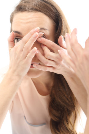 Woman found contact lenses の写真素材