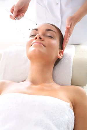 Portrait of a beautiful woman in a beauty salon, relaxation, luxury, peace.の写真素材