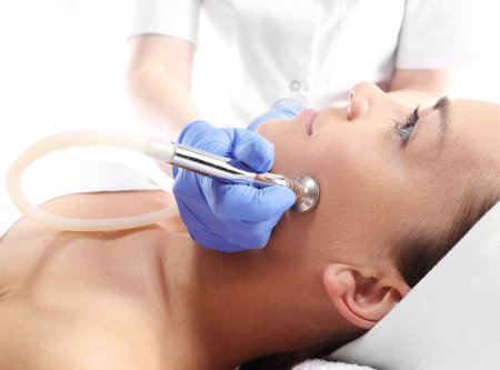 Relaxed woman during a microdermabrasion treatment in beauty salonの写真素材