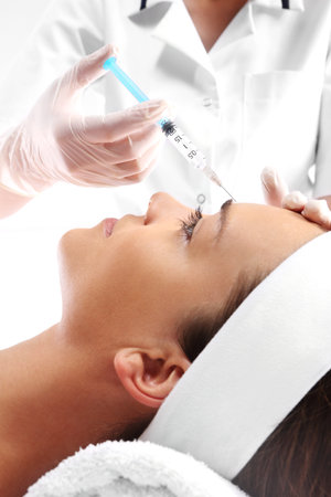 Plastic surgery, a woman in the clinic of aesthetic surgeryの写真素材