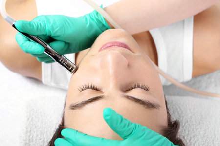 Portrait of a young man groomed during the treatment in the beauty salonの写真素材