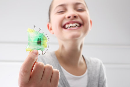 Portrait of a little girl with orthodontic applianceの写真素材
