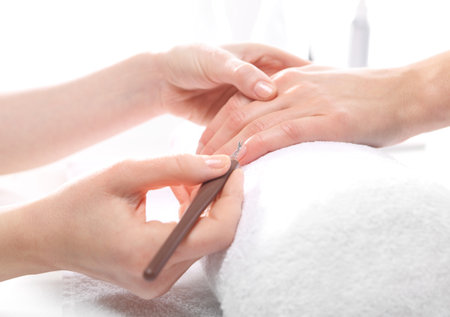 Manicure, cutting skins woman to a beauticianの写真素材