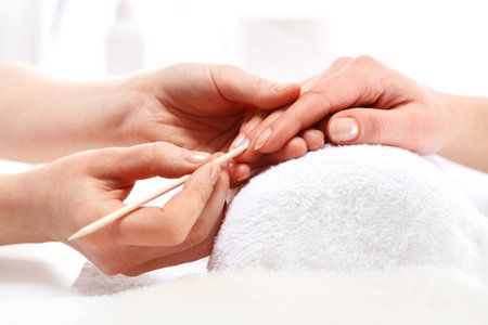 Manicure, pushing skins, a woman to a beauticianの写真素材