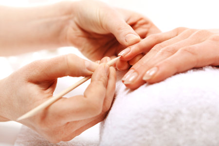 Manicure, pushing skins, a woman to a beauticianの写真素材