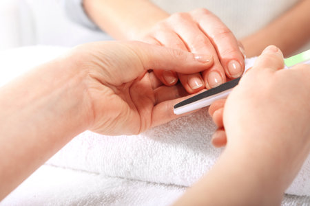 Nail sawing a woman in a beauticianの写真素材