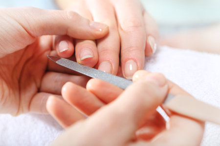 Nail sawing a woman in a beauticianの写真素材