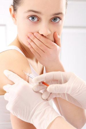 Frightened child vaccinationの写真素材