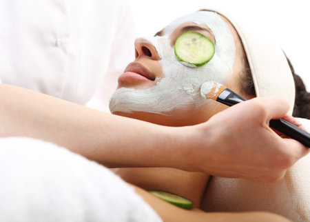 Cosmetic moisturizing mask is applied to the face of a woman.の写真素材