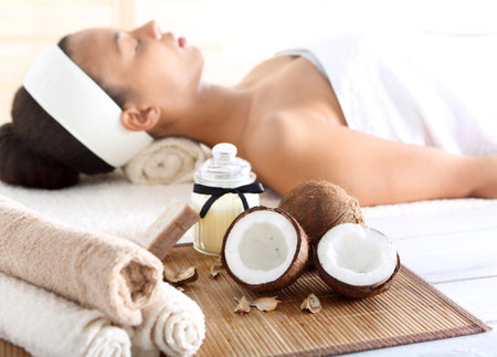 Wellness & spa treatment with coconut oil, feminine relaxationの写真素材