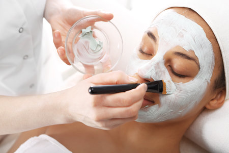 Green mask, woman in spa salonの写真素材