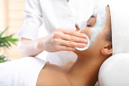 Cleansing the skin, wash the mask with a cotton swabの写真素材
