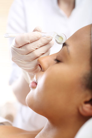 Mesotherapy microneedle, the woman at the beauticianの写真素材