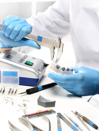 Hands prosthetics, orthodontics while working on orthodontic applianceの写真素材