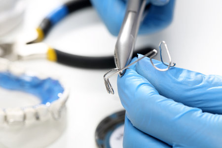 Hands prosthetics, orthodontics while working on orthodontic applianceの写真素材