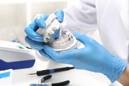 Prosthetics hands while working on orthodontic appliance