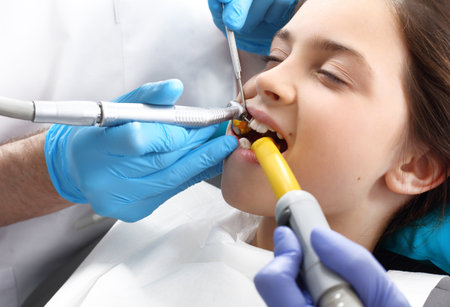 Child in the dental chair dental treatment during surgery.の写真素材