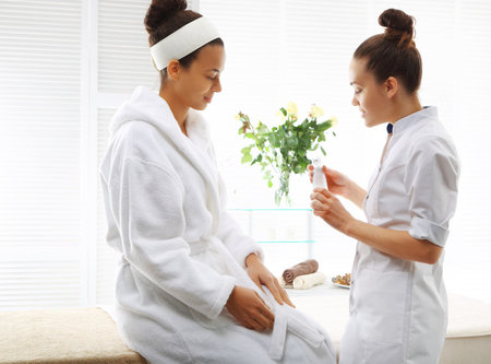 Beautician advises client the appropriate cosmetics to her skin type
の写真素材