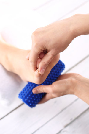 Foot Massage and physiotherapy.Female foot massage device massaged.の写真素材