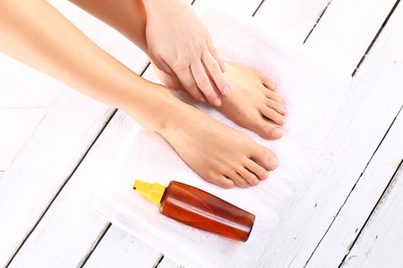 Prepare the foot until the summer .Beautiful slim female feet located on the towelの写真素材