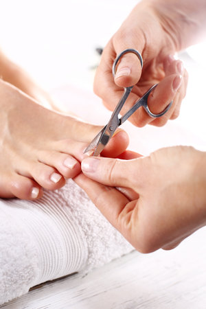 Trimming toenails, woman on pedicureの写真素材