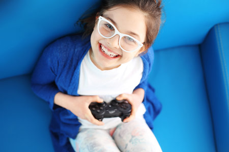 I love to play! Child playing video gameの写真素材
