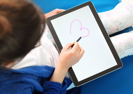 First love, girl draws a heartの写真素材