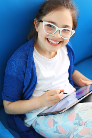 Child playing with tabletの写真素材