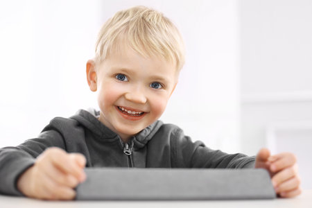 Smiling boy and digital tabletの写真素材