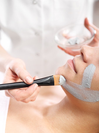 Cosmetic moisturizing mask is applied to the face of a woman.の写真素材