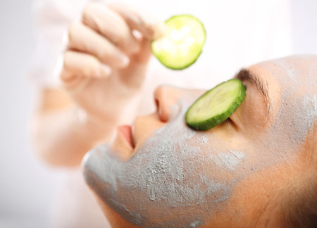 Cosmetic moisturizing mask is applied to the face of a woman.の写真素材