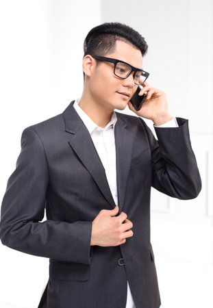 Business conversation worker talking on the phoneの写真素材