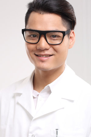 Handsome doctor in white coatの写真素材