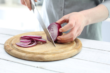 Cutting the onion into slicesの写真素材