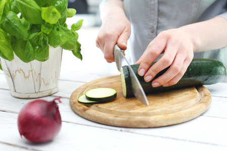 Zucchini woman preparing a mealの写真素材